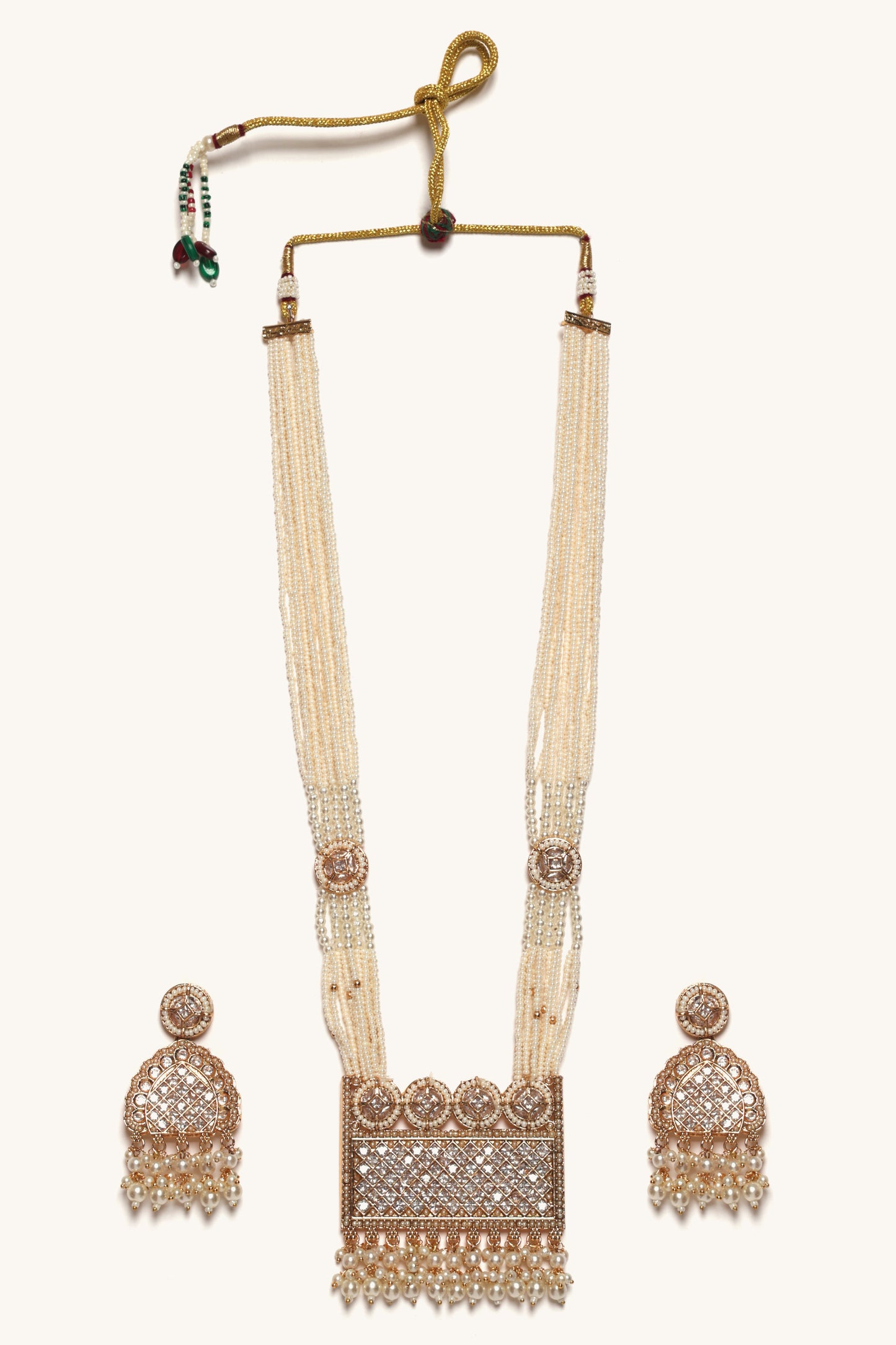 Beige beaded necklace with matching earrings on a white background