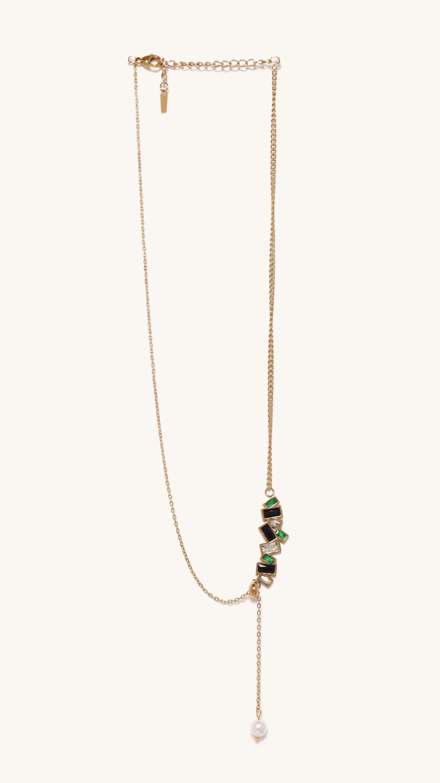 Gold necklace with green gemstones on a white background