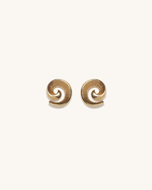 Pair of gold spiral earrings on a white background