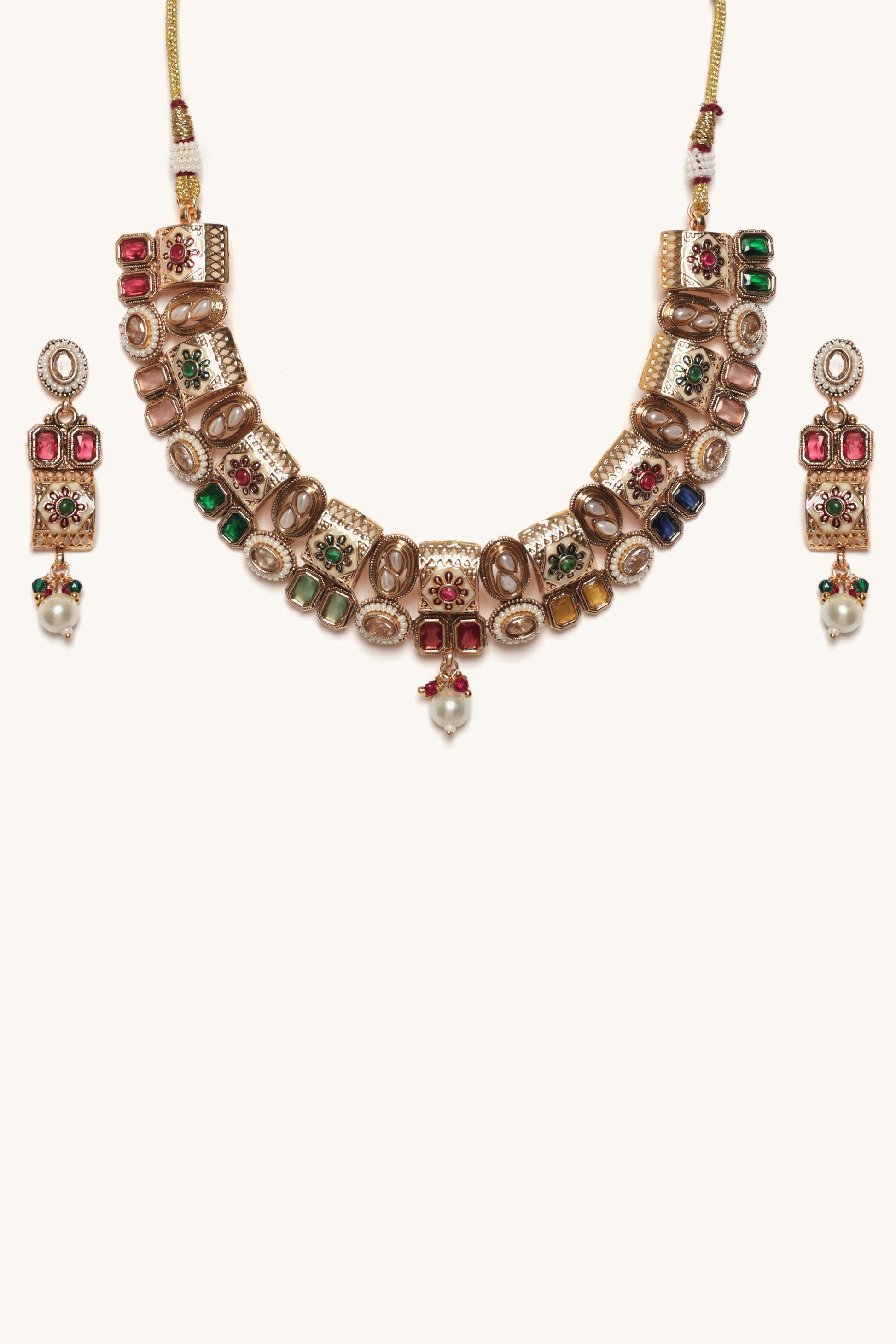 Ornate necklace with colorful gemstones on a white background