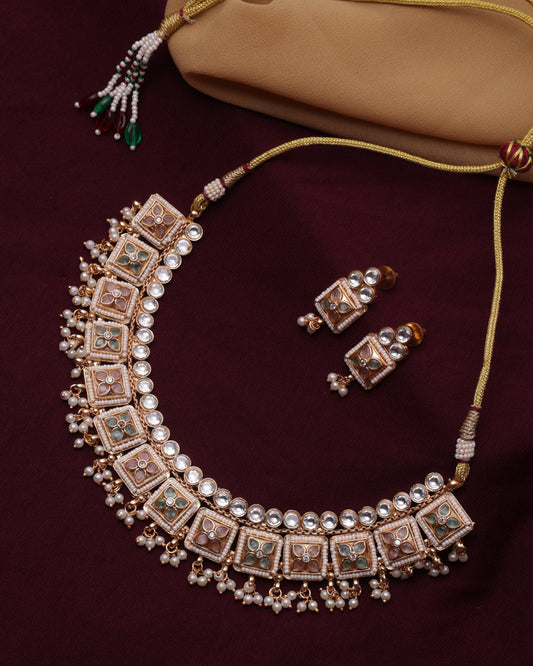 Jewelry set with headband and earrings on a maroon background